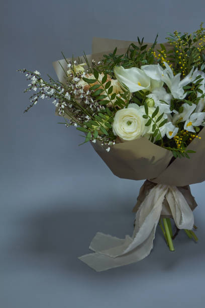 istock Romantic wedding or congratulatory bouquet, light gray background, selective focus 1205403009