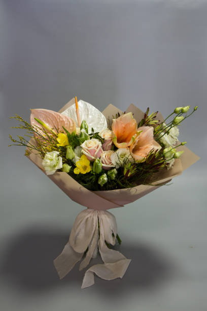 istock Beautiful summer bouquet in pink colors, gray backdrop, selective focus 1205403104