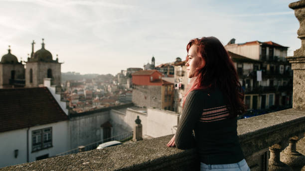 istock Young woman with dyed red hair 1205403973