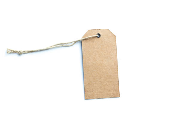 istock Blank brown cardboard price tag or label with thread isolated on white background. 1205407800