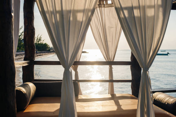 istock White luxury bed on the beach in mexico 1205409487