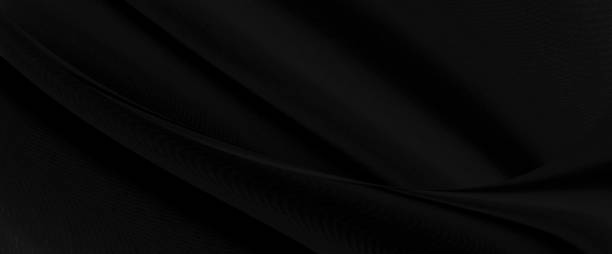 istock Black gray satin dark fabric texture luxurious shiny that is abstract silk cloth panorama background with patterns soft waves blur beautiful. 1205409678