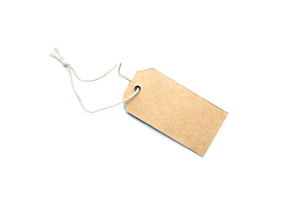istock Blank brown cardboard price tag or label on white background. 1205409719
