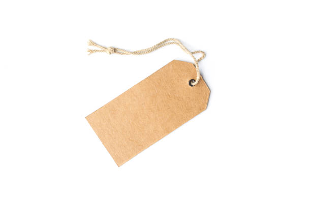istock Blank brown cardboard price tag or label with thread isolated white background.price tag 1205410248
