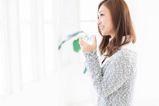 istock asian woman who drinks water 1205410551