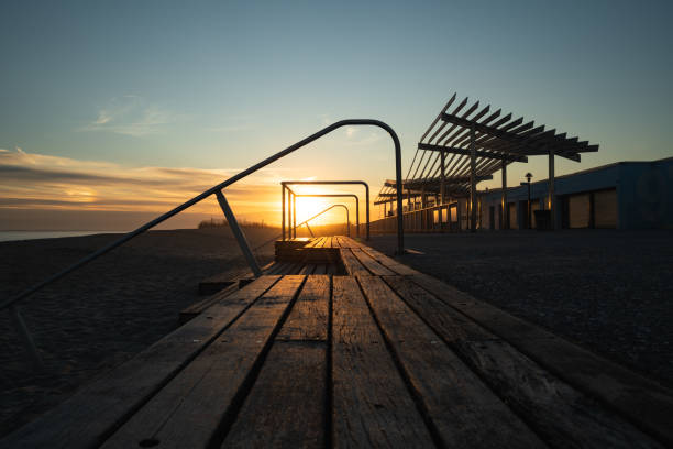 istock Sunset at Rockaway Beach Boardwalk 1205411373