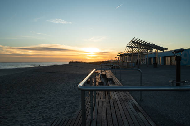 istock Sunset at Rockaway Beach Boardwalk 1205411377