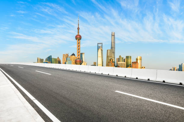 istock Urban architecture landscape and empty asphalt road in Shanghai 1205412257