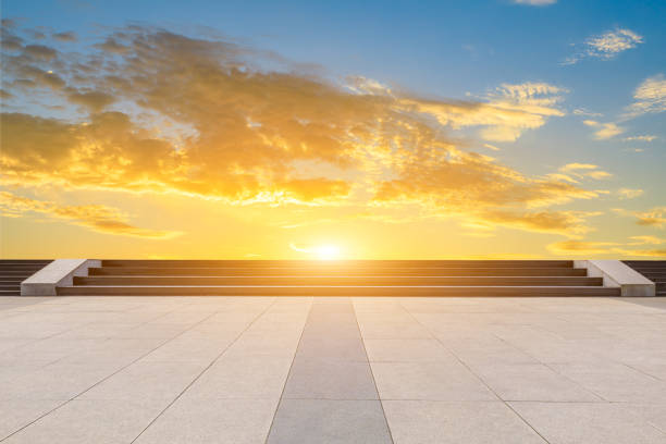 istock Square pavement and colorful sky at summer sunset 1205413042