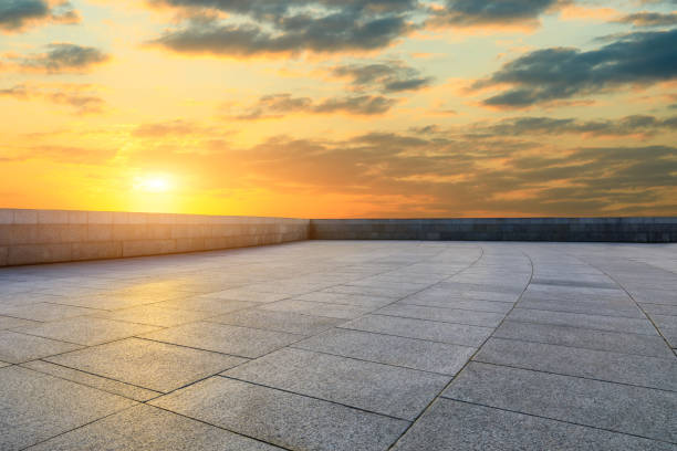 istock Square pavement and colorful sky at summer sunset 1205413197
