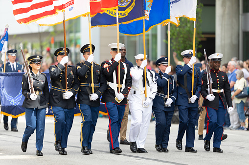Indianapolis, Indiana, USA - May 25, 2019: Indy 500 Parade, Members of the United States military escorting the American flag down Pennsylvania Street