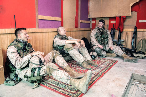 istock Soldiers communicating and resting after mission on outpost 1205420000