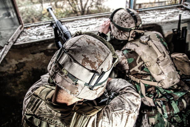 army sniper team shooting with large caliber rifle - war armed forces military conflict imagens e fotografias de stock