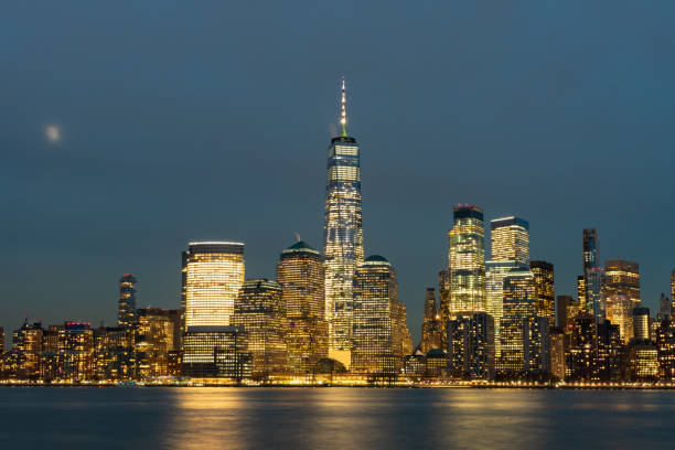 istock Lower Manhattan New York City Skyline at Night with the Moon 1205420743