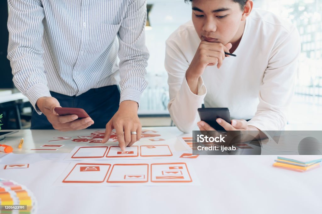UX UI and Programming development technology. Programmer and UX UI designer working in a software development and coding technologies. Mobile and website design and programing development technology. User Experience Stock Photo