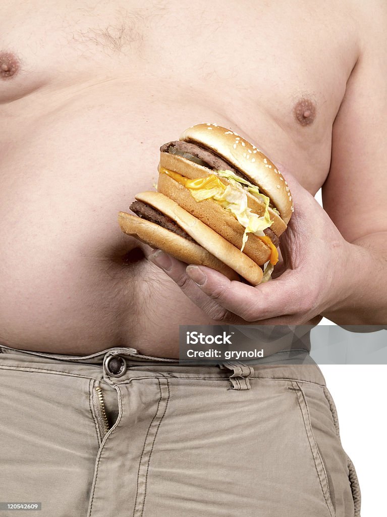 Hamburger w rękę - Zbiór zdjęć royalty-free (Brzuch człowieka)