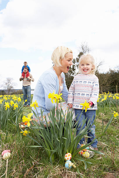 istock Family On Easter Egg Hunt In Daffodil Field 120543605