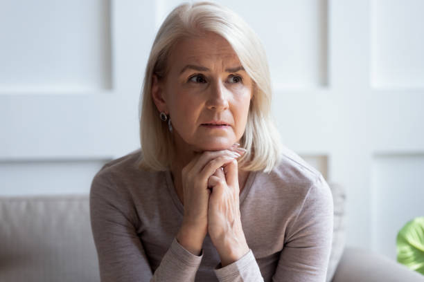 istock Sad senior woman look in distance thinking or mourning 1205448216