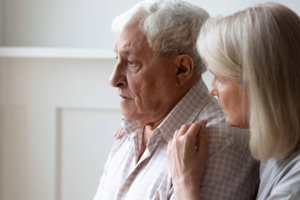 istock Loving senior wife hug comfort sad elderly husband 1205448280