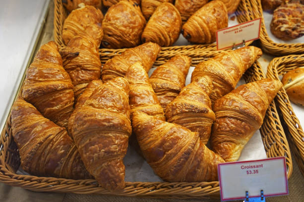 istock Close up basket of plain butter croissant in display showcase box 1205448480