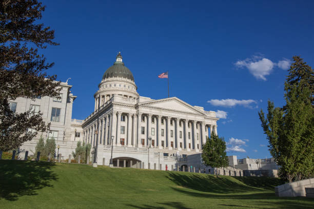 A low-angle and wide-angle view of the historic Salt Lake City and County Building, against blue sky, on a sunny Winter evening. Downtown of Salt Lake City, Utah, USA.