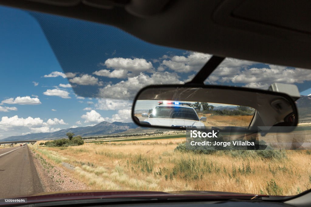 Police pulling over vehicle on the streets Stop - Single Word Stock Photo