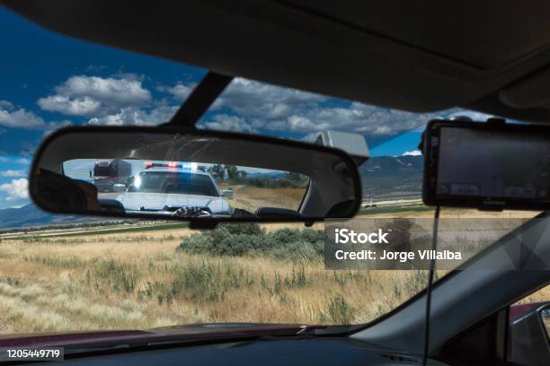 Police Pulling Over Vehicle On The Streets Stock Photo - Download Image Now - Stop - Single Word, Police Force, Pulled Over by Police