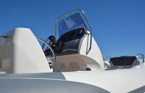 Close up on motorboat, speedboat details. A motorboat, speedboat, or powerboat is a boat which is powered by an engine.