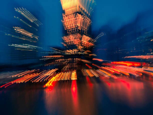 istock Abstract Action Night Citysacpe of Exploding Light Trails Dancing over the Sea Water 1205452628