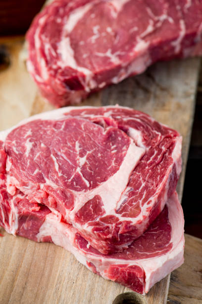 istock Steak filet migon. Grade A, grass fed angus beef. Traditional classic New York steakhouse menu favorite. T-bone steak whole raw and uncooked. 1205457233
