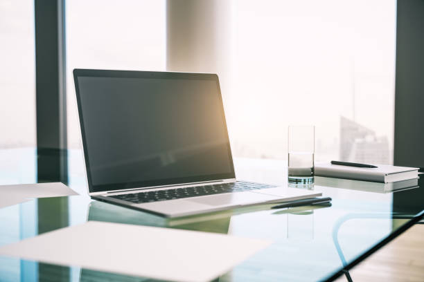 istock Morning desktop with laptop and a window with a city view. Mockup. 3D Rendering 1205459677