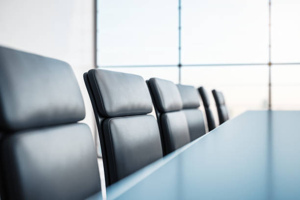 istock Closeup of conference table with chairs. 3D Rendering 1205459933