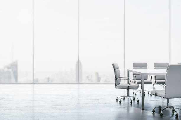 Furnished white conference room with table, chairs and large window overlooking the city. 3D Rendering stock photo
