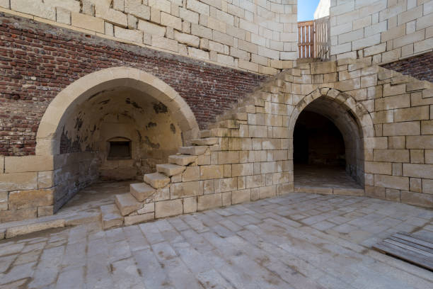 istock Ancient brick building with shabby stone stairway and two crumbling arched alcoves 1205461030