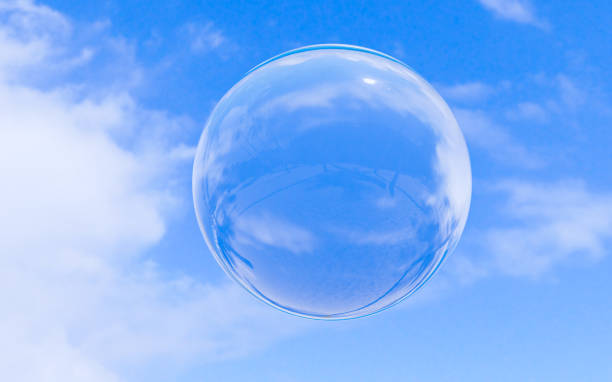 istock Bubble soap on blue sky with clouds background texture in bright morning. 3d ball, round circle. Transparent glass sphere for clean atmosphere. Nature abstract white cloudscape in sunny day. 1205462124