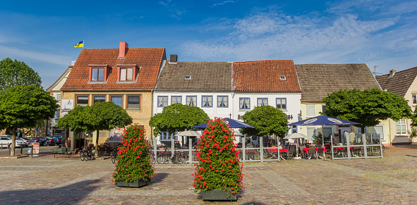 Panorama of the market square with restaurants and cafes in Schleswig, Germany
