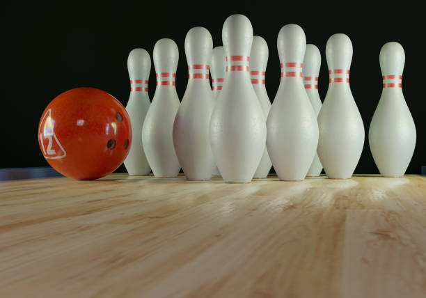 istock Bowling pins and bowling ball on the alley 1205470365