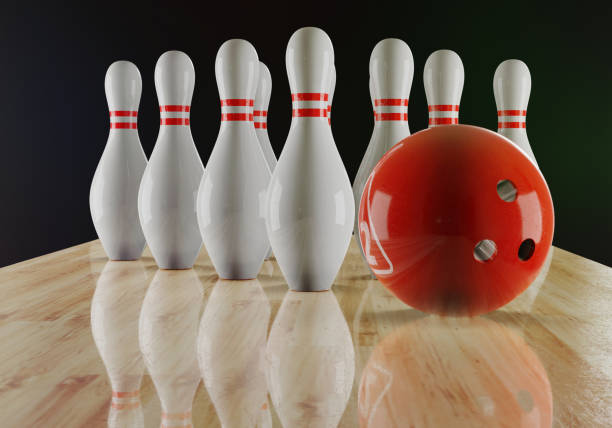 istock Bowling pins and bowling ball on the alley 1205470381
