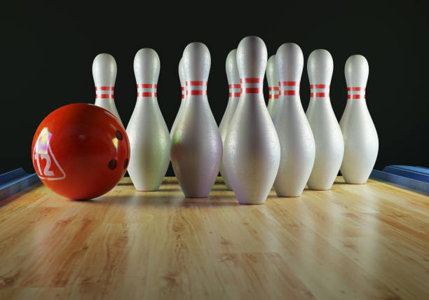 istock Bowling pins and bowling ball on the alley 1205470390