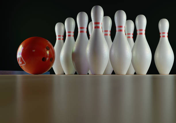 istock Bowling pins and bowling ball on the alley 1205470392