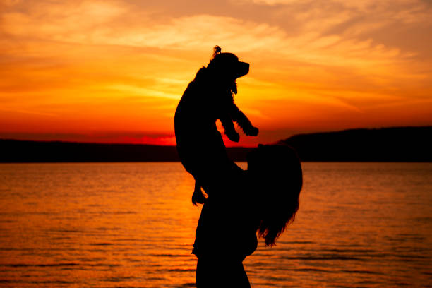 Happy dog and lovely woman.