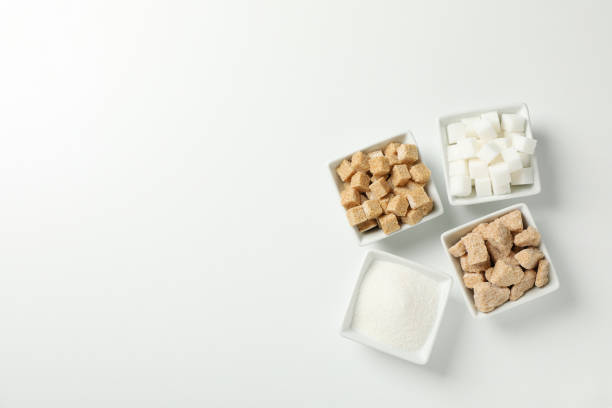 istock Square bowls with sugar on white background, top view 1205473401