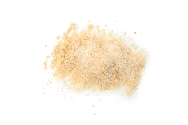 istock Brown sugar isolated on white background, top view 1205474825