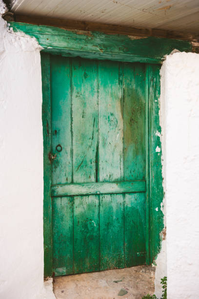 istock Rusty old green entrance by on Karpathos 1205476454