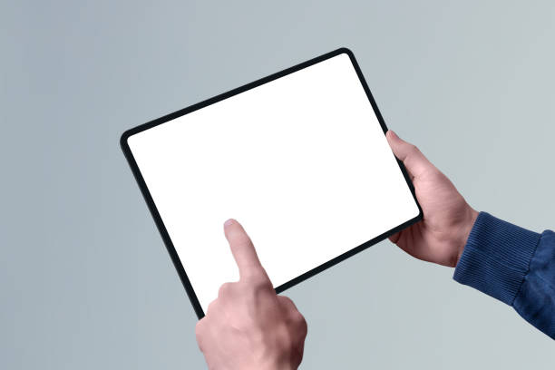 istock Tablet mockup in horizontal position in man hand. Left hand touch isolated screen concept 1205477691