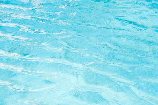 istock swimming pool water background a pure water surface blue ocean color scenery soft focus above abstract spring waves ripple for healthy and globe environmental concept 1205478407