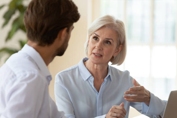 istock Serious diverse businesspeople talk discuss ideas at meeting 1205480426