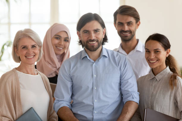 istock Portrait of multiethnic work team posing together in office 1205480430