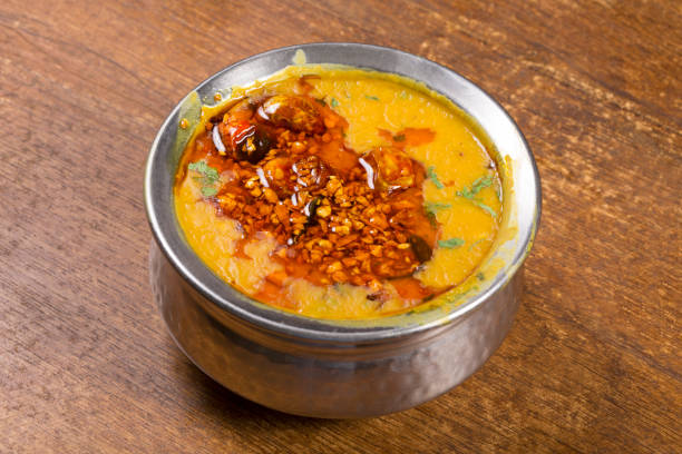 Dal Tadka cooked lentils which are lastly tempered with oil or ghee fried spices & herbs stock photo
