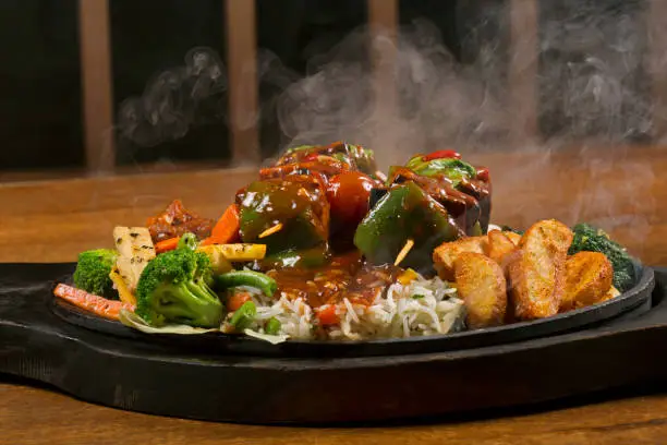 Grilled Caribbean Vegetarian Kebabs on hot plate